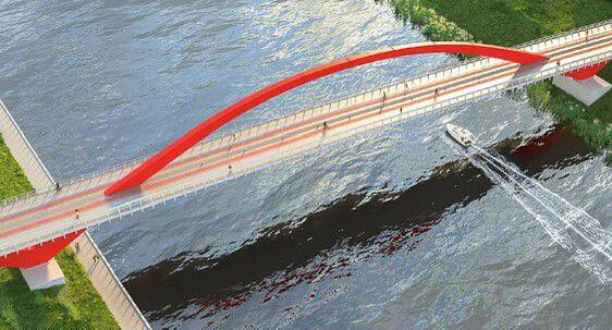 Еще один пешеходный мост строят в Мневниковской пойме в Москве Конструкция выполняется в серых цветах с включением красных акцентов что соответствует стилистике Гагаринского моста Идут подготовительные работы скоро появятся искусственные полуострова где будут краны для сборки пролетных строений Затем появится арка установят и натянут вантовую систему Строительство не будет мешать судоходству Открытие обоих объектов планируется в 2027 году что создаст прямой рекреационный маршрут между районами Крылатское и Филевский парк